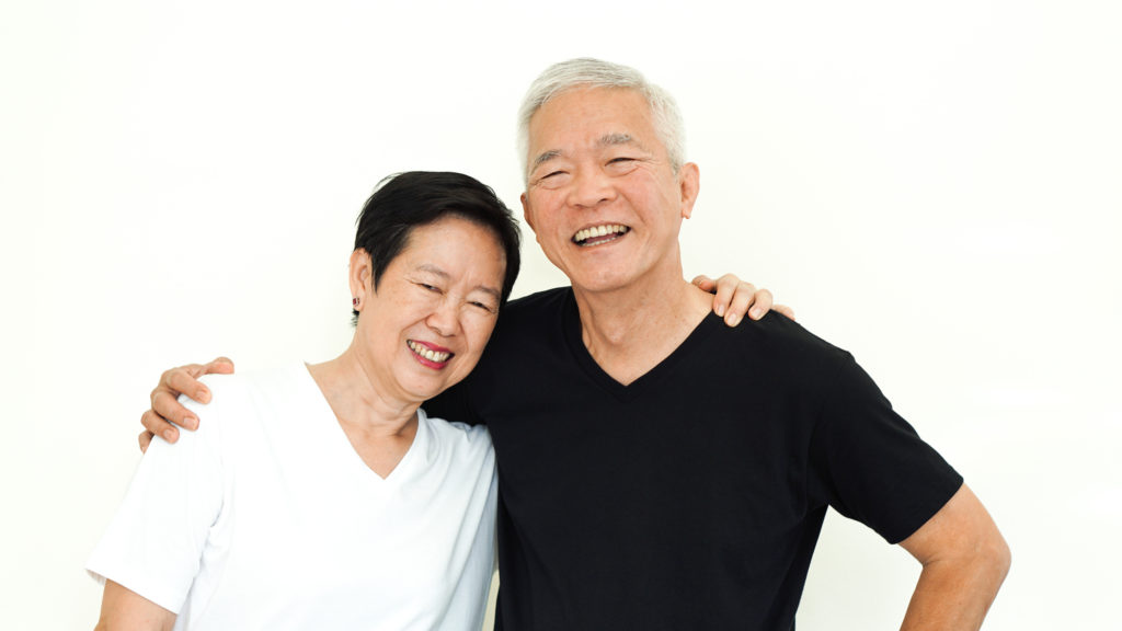 Older smiling couple with dentures